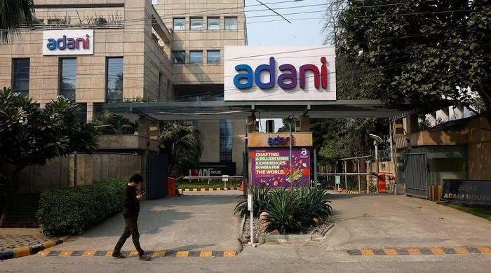 India’s parliament suspended over Adani brib…