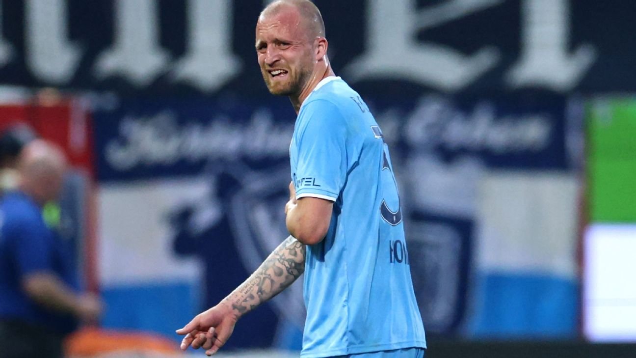 Bundesliga relegation clash leaves two players in hospital