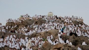 Pilgrims pray at Mount Arafat in Hajj apex