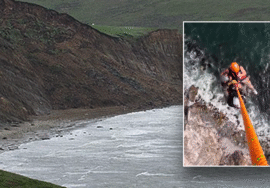 Helicopter hoists hikers from dangerous beach trap
